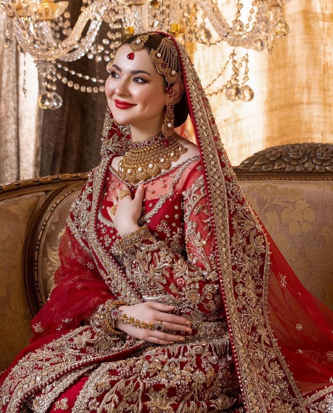 Hania Aamir Flaunts Elegance in Traditional Red Bridal attire